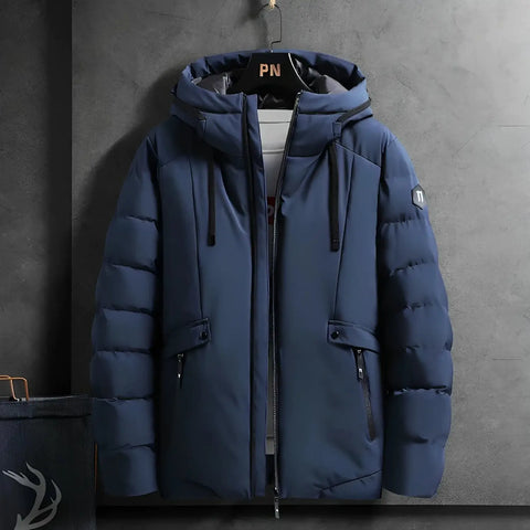 Navy blauwe puffy Tommy parka winterjas met capuchon en rits voor de winter.