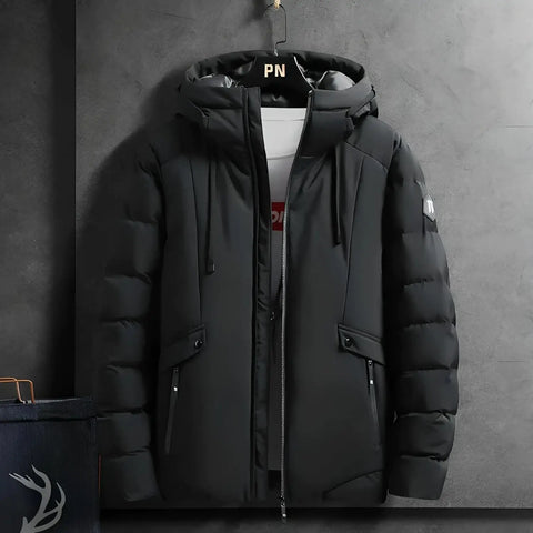 Zwarte puffy winterjas met capuchon, onderdeel van de Tommy™ parka winterjas collectie.