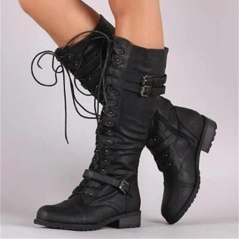 Pair of tall black lace-up combat boots met gespsluitingen in steampunk ontwerp